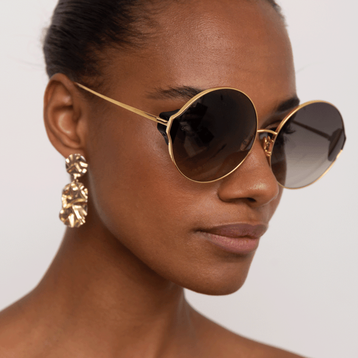 CAROUSEL ROUND SUNGLASSES IN YELLOW GOLD